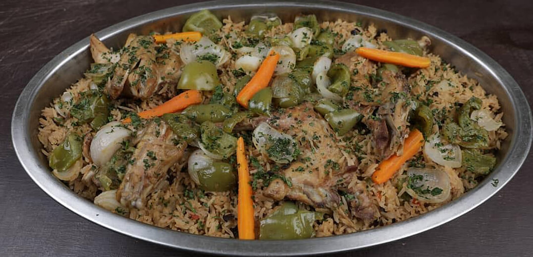 Riz au Soumbala avec du poulet bicyclette