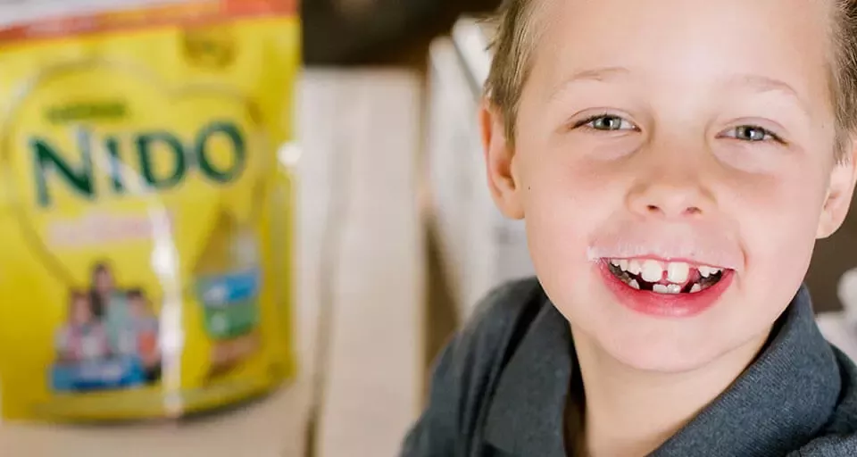 boy drinking NIDO