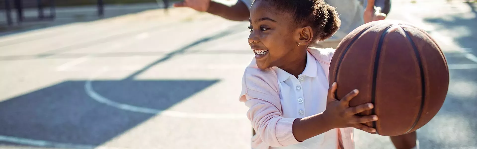 Kid playing basketball