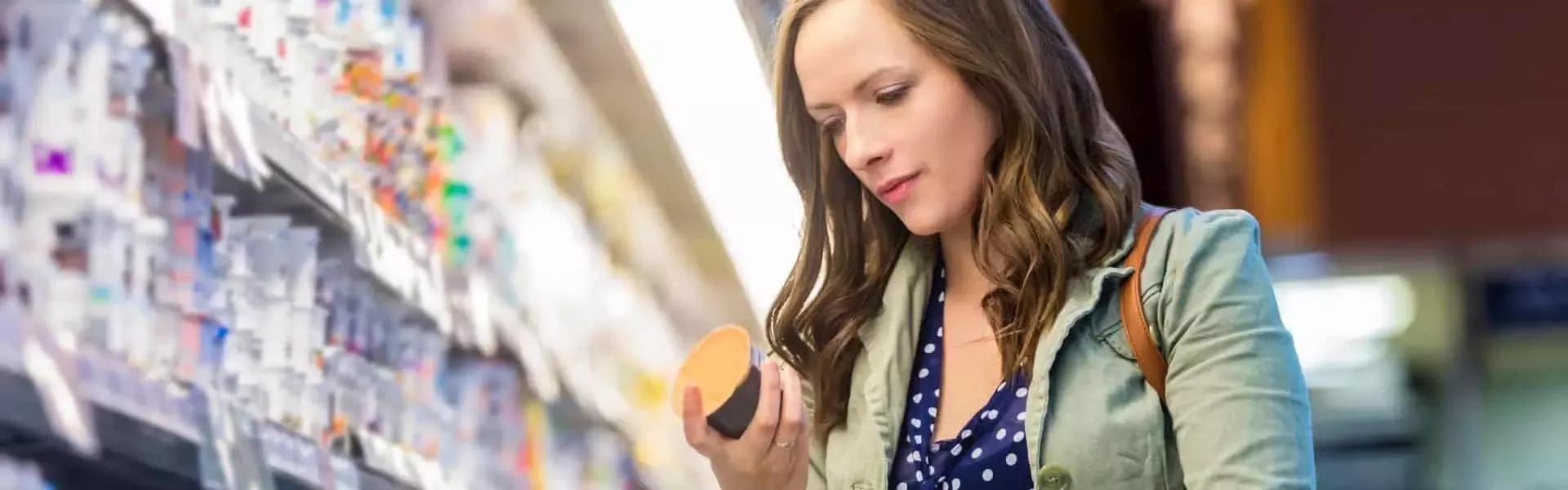 Woman is picking up the products in the market
