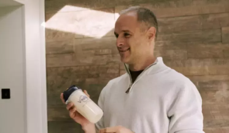 Man with a Vitaflo bottle