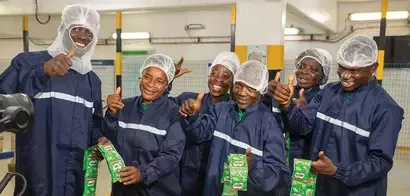 Ketewa farmers hold milo products on a farm