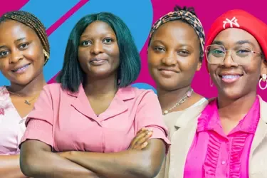 Four diverse women standing confidently with arms crossed or relaxed, against a vibrant pink and blue background.